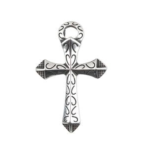Silver vintage cross pendant with intricate black totem patterns on white background