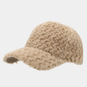 Cozy beige faux fur baseball cap with a textured wavy pattern for winter warmth and style.