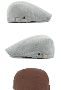 Detailed macro view of knitted cotton beret showing texture and side metal adjustment buckle