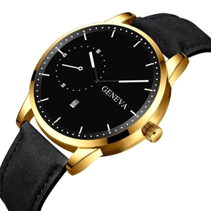 Macro shot of the luxury gold metal case and black leather strap of the Geneva quartz watch