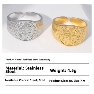 Macro shot of St. Benedict Medal rings in gold and silver finish with detailed specs