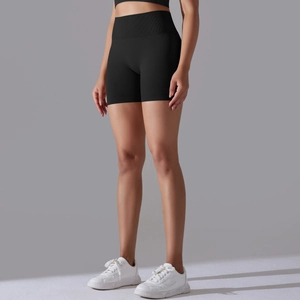 Close-up of black seamless high-waist workout shorts with ribbed waistband for yoga