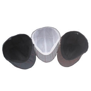 Detailed top view of plaid flat caps showing breathable mesh lining and inner sweatband