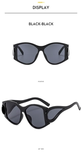 Detail of Y2K sunglasses featuring unique hollowed-out side wings in black finish