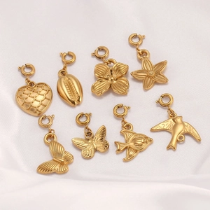 Golden stainless steel ocean and nature charm set including starfish and butterfly