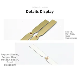 Detailed view of polished gold and silver metal clock hands with brass ring fittings