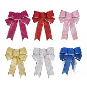 Set of six colorful glitter Christmas bows in red gold silver and blue holiday decor