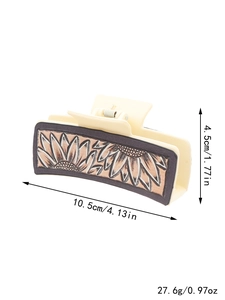 Beige cowboy leather hair claw clip featuring a dark sunflower embossed pattern
