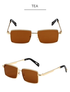 Detail of square tea lenses and golden metal frame on retro fashion sunglasses