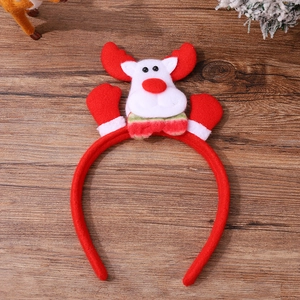 Detail of red plush Christmas headband featuring a cute reindeer with striped bow tie