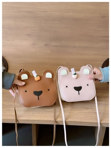 Detail of brown and pink cute bear PU leather crossbody bags for kids with adjustable straps