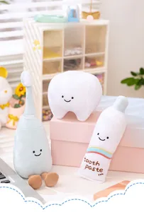 Detail of plush tooth, toothpaste, and toothbrush toy set with cute smiling faces