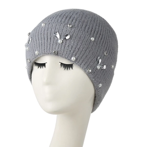 Women's dark grey knit beanie with rhinestones and faux pearls on white mannequin