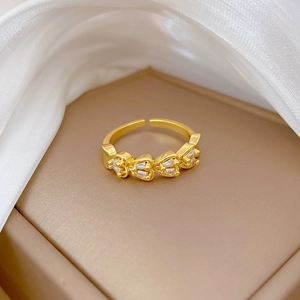 Adjustable gold plated ring with double row heart-shaped cubic zirconia on silk
