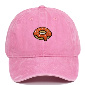 Close-up of pink washed cotton baseball cap with detailed donut embroidery
