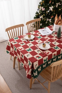 Close-up of waterproof polyester Christmas tablecloth with reindeer and red plaid pattern