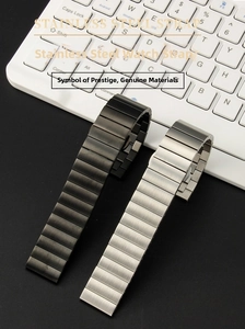 Detail of solid stainless steel watch bands in black and silver with brushed finish