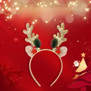 Detailed close-up of Christmas reindeer headband with gold sequins and festive bells