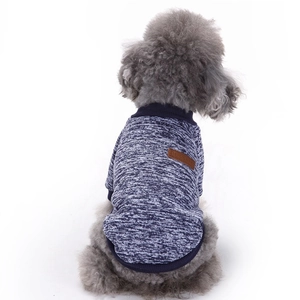 Detailed back view of a blue knitted dog sweater with ribbed collar and classic patch