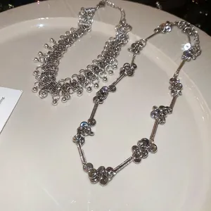 Silver metallic beaded choker and tassel fringe necklace set in minimalist industrial style