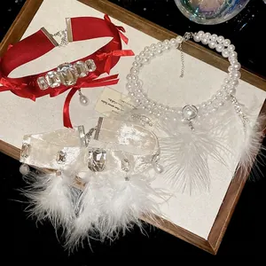 Elegant water drop feather tassel and pearl necklace set with crystal embellishments