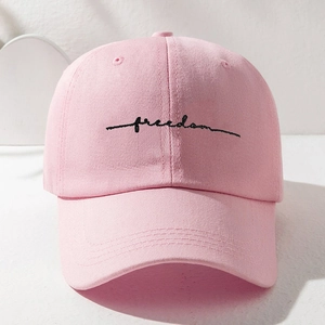 Close-up of the black Freedom embroidery on this pink premium cotton twill baseball cap