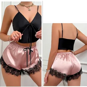 Two-piece sexy satin lingerie set with black V-neck camisole and pink lace shorts