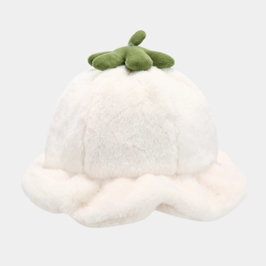 Detailed close-up of soft white plush bucket hat with green carrot top decoration