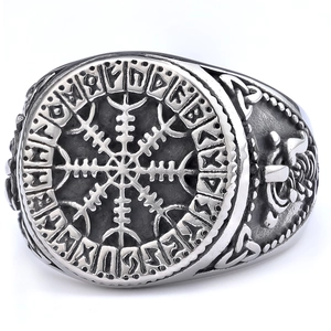 Vintage silver Viking ring with Wegvísir compass and Runic carvings on white background