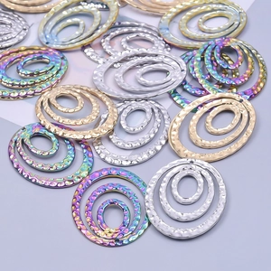 Oval hammered stainless steel jewelry charms in gold, silver and rainbow plating