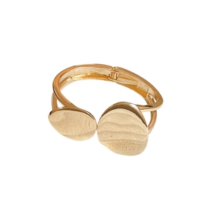 Irregular oval double-layer gold bangle with flat disc charms and spring hinge closure