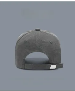 Detail of dark grey cotton baseball cap showing adjustable strap and metal buckle