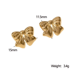 Macro shot of gold bow stud earrings showing dimensions of 15mm by 11.5mm and weight