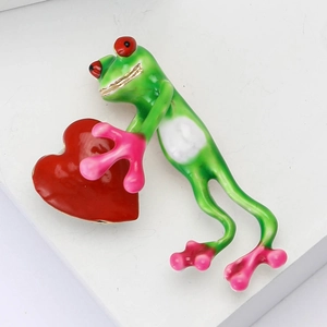 Creative alloy enamel frog brooch holding a red heart for unisex fashion clothing accessory