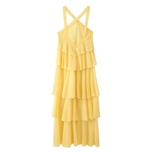 Detail of yellow backless dress with tiered ruffles and crisscross straps