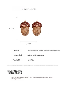 Detail view of vintage pinecone drop earrings with 925 silver needles and crystals