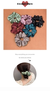 Set of six colorful silk satin scrunchies featuring decorative small metal nameplates