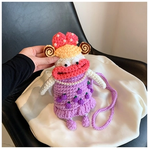 Detail of handmade crochet pink sausage mouth crossbody bag with pearl necklace decor
