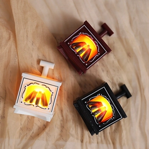 Three mini LED fireplace lanterns in white, red and black colors for holiday decor