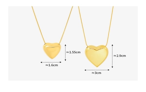 Detailed size comparison of large and small golden heart pendants on titanium steel chains