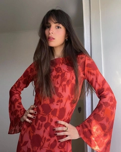 Detail of bohemian red floral maxi dress showing bell sleeves and off-shoulder neckline