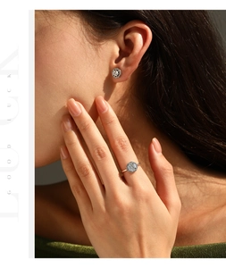 Close-up of vintage S925 silver octagonal ring and earring set with shimmering stones