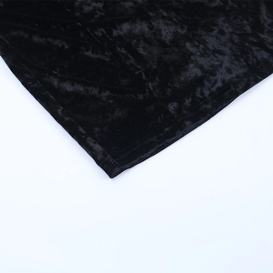 Detail of premium black velvet fabric showing professional stitching and texture