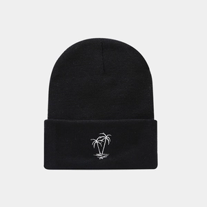 Close-up of white palm tree embroidery on a black ribbed knit beanie for men and women