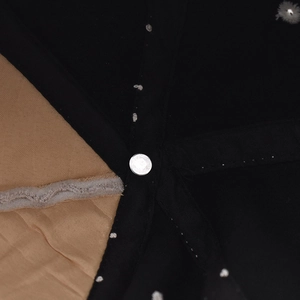 Macro detail of the interior metal rivet and stitching on a Hawaii cotton baseball cap