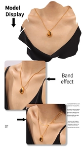 Tiger eye teardrop pendant necklace in 18k gold plated finish on female model