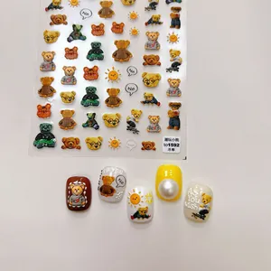 Detailed view of 5D embossed nail art stickers featuring trendy bear character designs