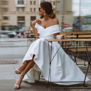 Elegant off-shoulder white satin high-low wedding dress with a crossover pleated bodice