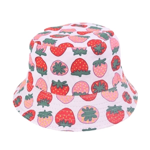 Close-up of white bucket hat with dense red strawberry print pattern for kids