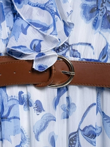 Detail of blue floral chiffon dress featuring a brown leather belt with metal ring buckle